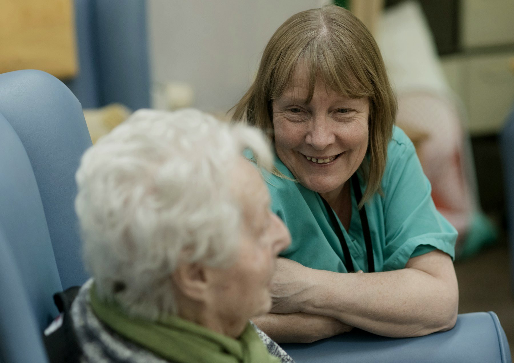 A nurse talking with an elderly resident