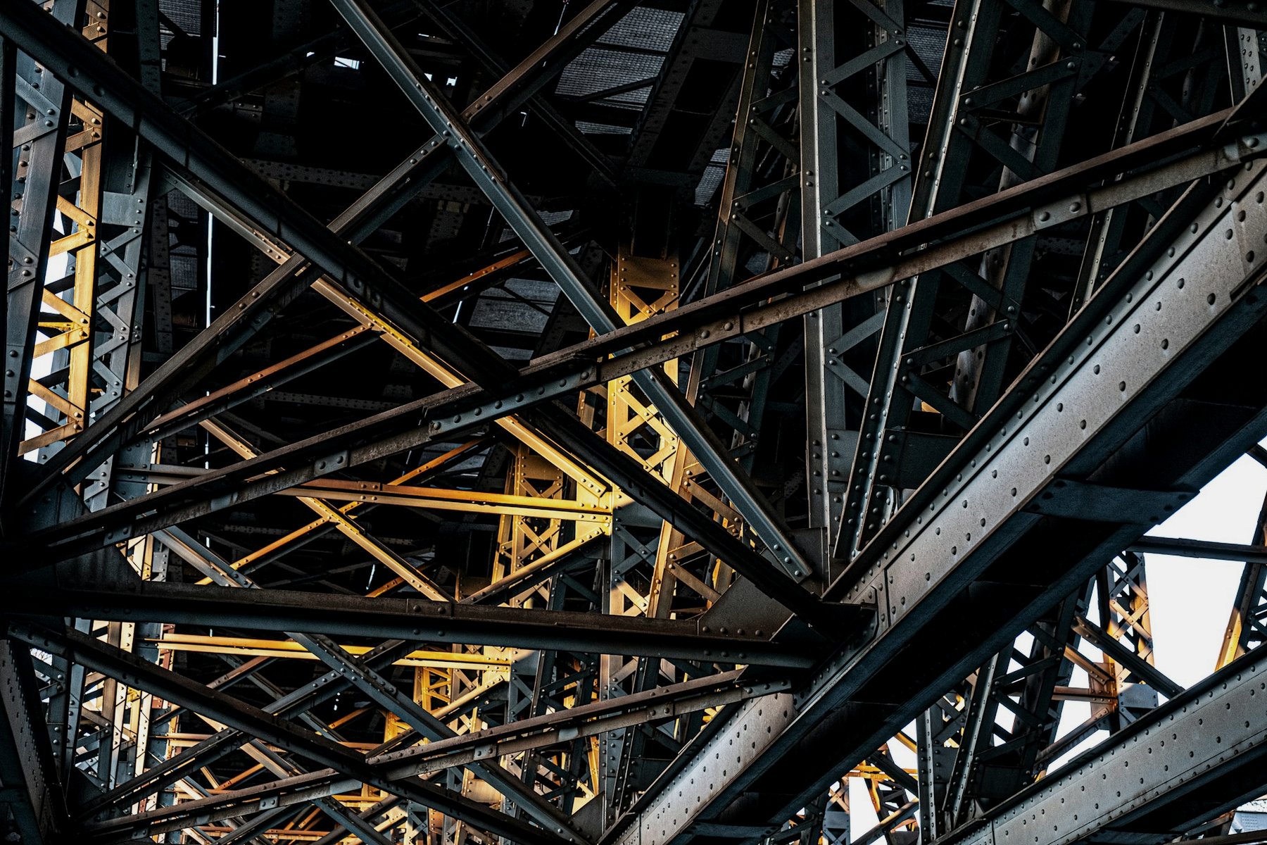 Steel girders of a tower structure, lit from below